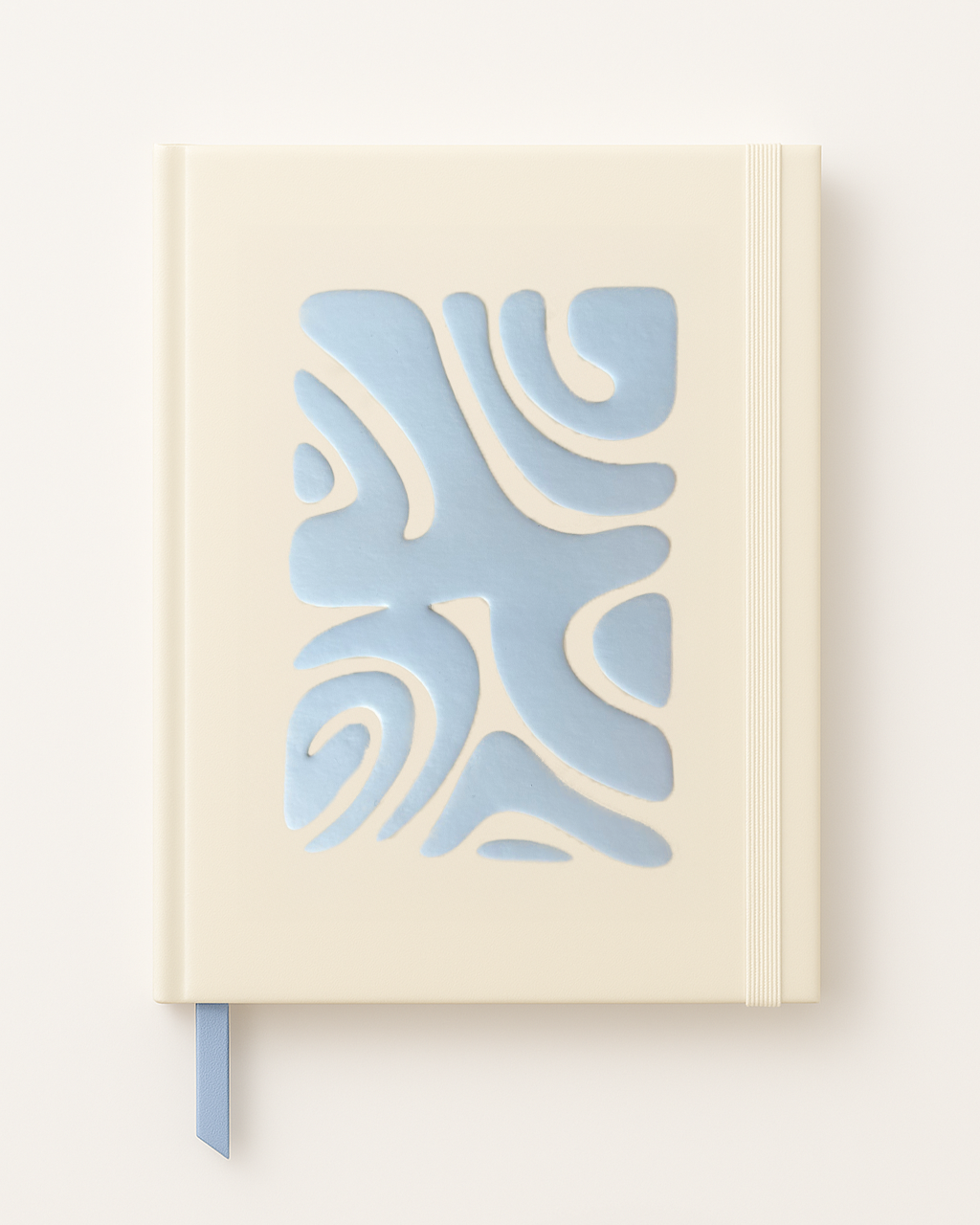 Notebook with a blue abstract design on a beige cover against a white background